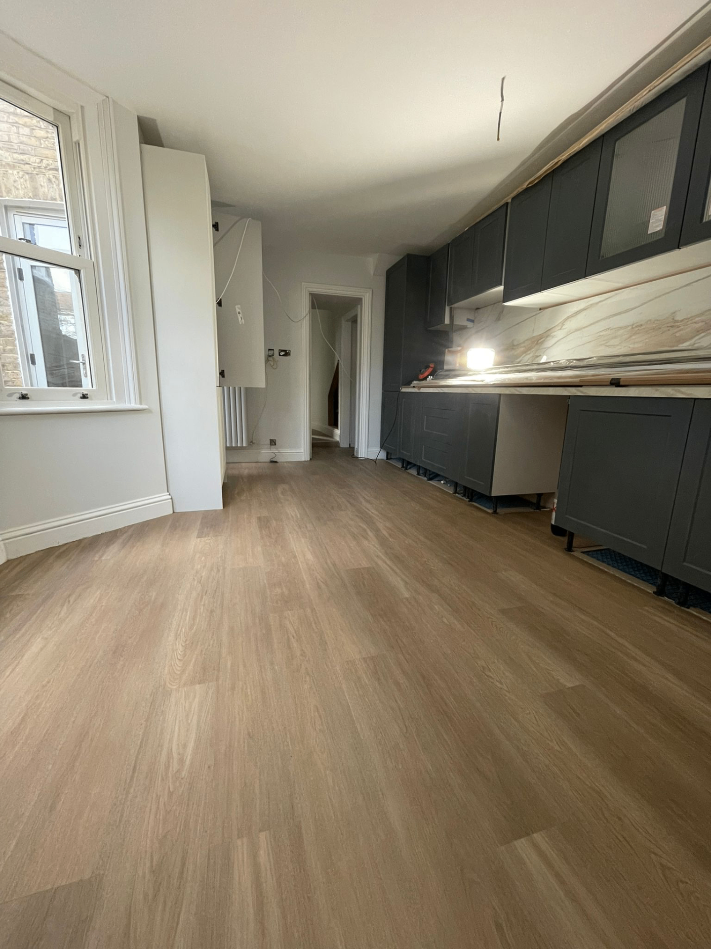 Navy kitchen with light LVT